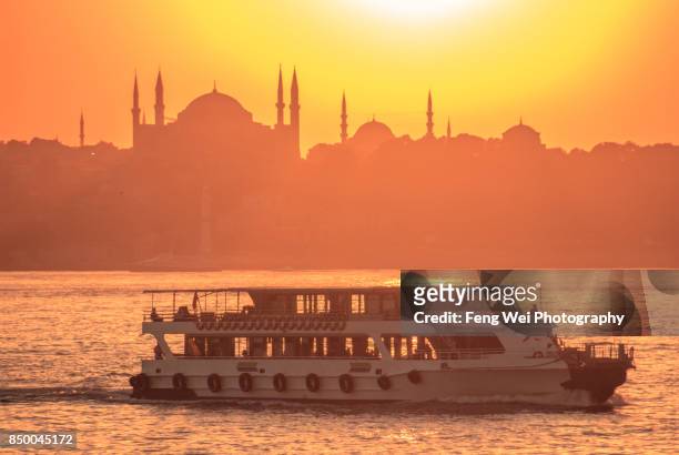 bosphorus sunset cruise, sultanahmet, istanbul, turkey - istanbul sunset stock pictures, royalty-free photos & images