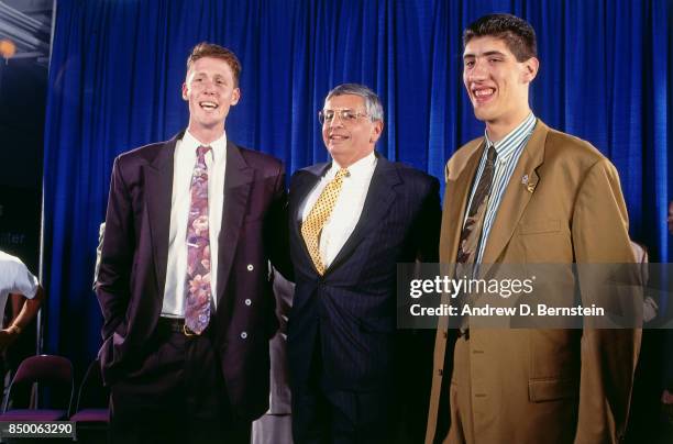 Shawn Bradley, number two overall pick by the Philadelphia 76ers, and Gheorge Muresan pose for a photo with NBA Commissioner, David Stern during the...