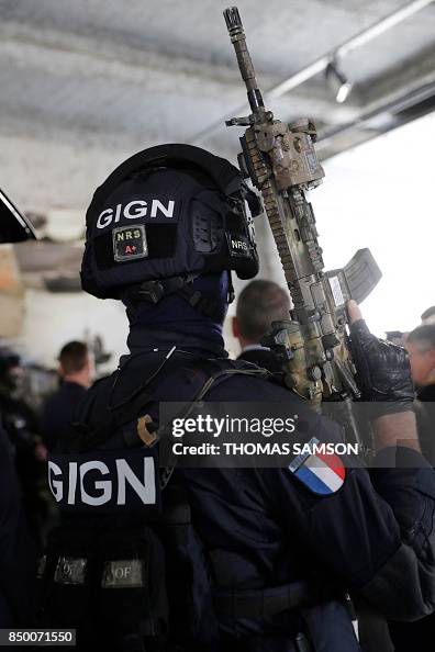 Gign Rappeling A member of the GIGN holds an assault rifle during a visit by the ...