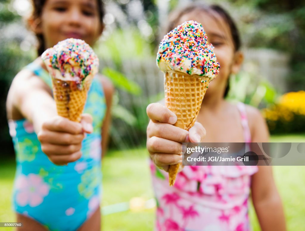 Hispanic girls eating ice cream cones