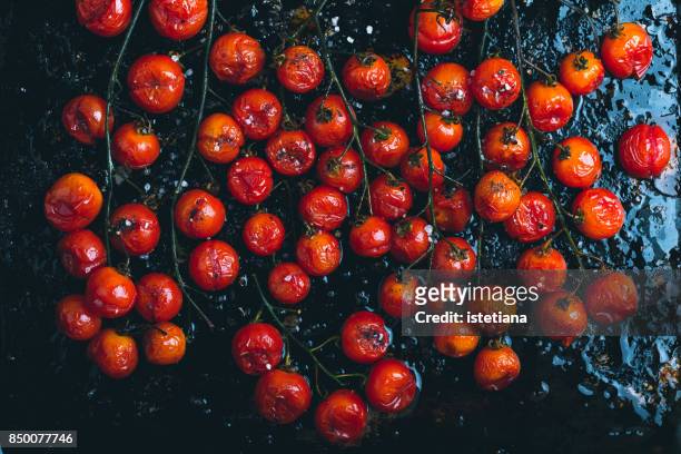 roasted cherry tomatoes - cherry tomato stock pictures, royalty-free photos & images