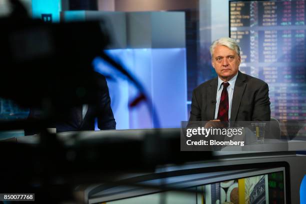 John Ryding, co-founder and chief economist of RDQ Economics LLC, listens during a Bloomberg Television interview in New York, U.S., on Wednesday,...