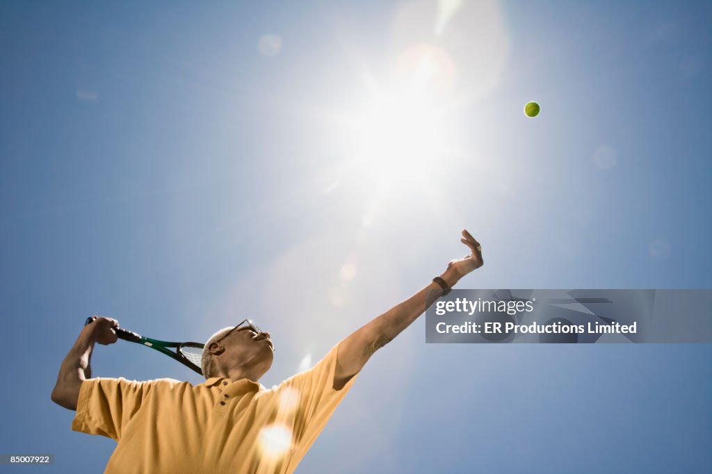 African man playing tennis