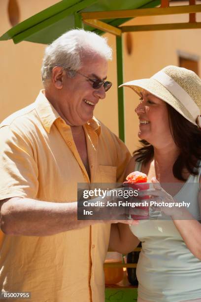 hispanic couple drinking frozen drink - frozen drink foto e immagini stock