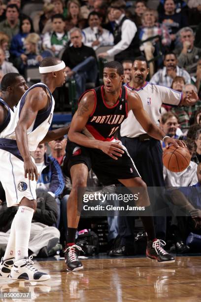 LaMarcus Aldridge of the Portland Trail Blazers moves the ball against Jason Terry of the Dallas Mavericks during the game at American Airlines...