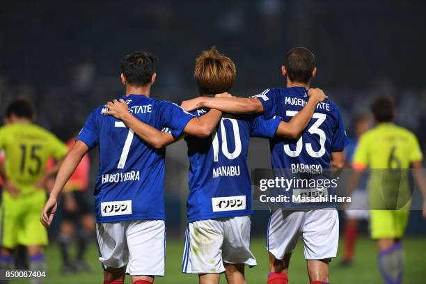 Hugo Vieira,Manabu Saito and David Babunski of Yokohama F.Marinos celebrate the win during the 97th Emperor's Cup Round of 16 match between Yokohama...