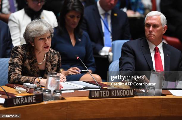Vice President Mike Pence and British Prime Minister Theresa May attend a meeting of the UN Security Council on peacekeeping operations, during the...