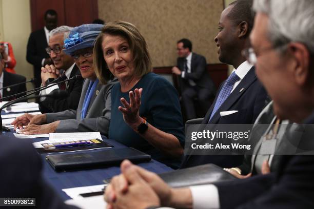 House Minority Leader Rep. Nancy Pelosi speaks as Rep. Alma Adams and Rep. Bobby Scott listen during a roundtable discussion September 20, 2017 on...