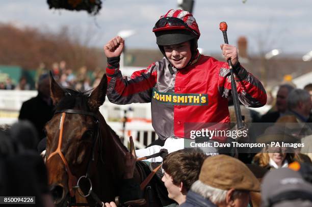 Jamie Hamilton celebrates on Tartan Snow after winning the John Smith's Fox Hunters' Chase during Grand Opening Day of the 2013 John Smith's Grand...