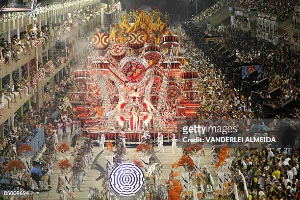 Academicos do Salgueiro samba dancers perform atop of a float along the Sambodrome on the second night of the Carnival samba school parade in Rio de...