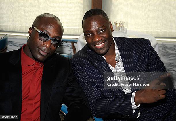 Fashion designer Ozwald Boateng and actor Adewale Akinnuoye-Agbaje pose at the UK Film Council US Post Oscars Brunch on February 23, 2009 at...