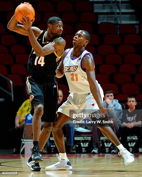 Jackie Manuel of the Erie Bayhawks keeps the ball away from Patrick Sanders of the Iowa Energy on February 23, 2009 at Wells Fargo Arena in Des...