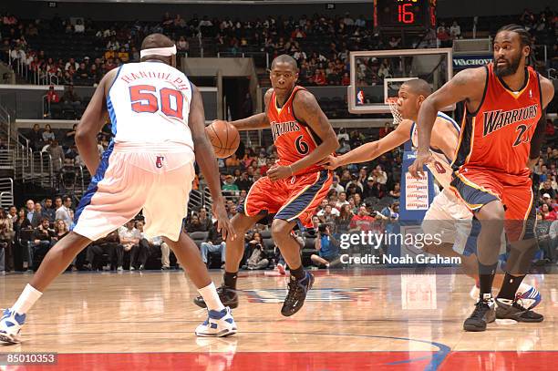 Jamal Crawford of the Golden State Warriors handles the ball against Eric Gordon of the Los Angeles Clippers at Staples Center on February 23, 2009...