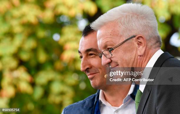 German Greens' Party co-leader Cem Ozdemir and Baden-Wuerttemberg's state premier Winfried Kretschmann attend an election campaign rally of the...