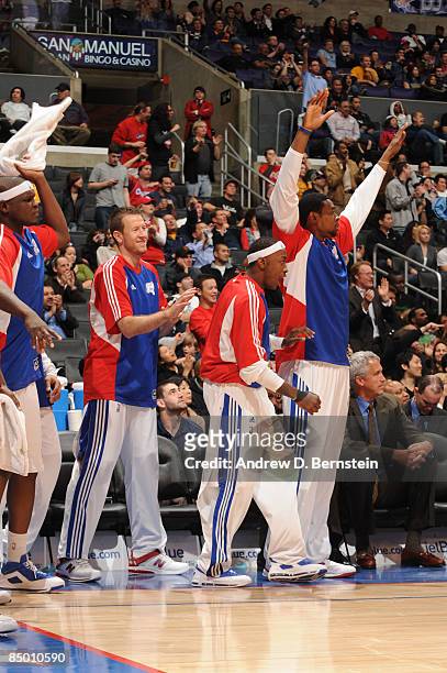 Zach Randolph, Steve Novak, Mike Taylor 4, and DeAndre Jordan of the Los Angeles Clippers celebrate from the bench during their game against the...