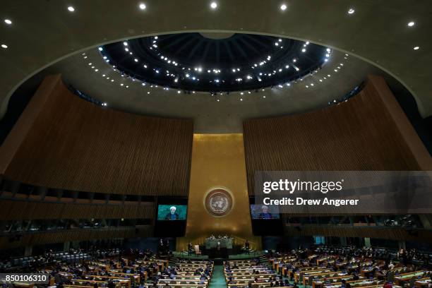 Hassan Rouhani, President of the Islamic Republic of Iran, is displayed on monitors as he addresses the United Nations General Assembly at UN...