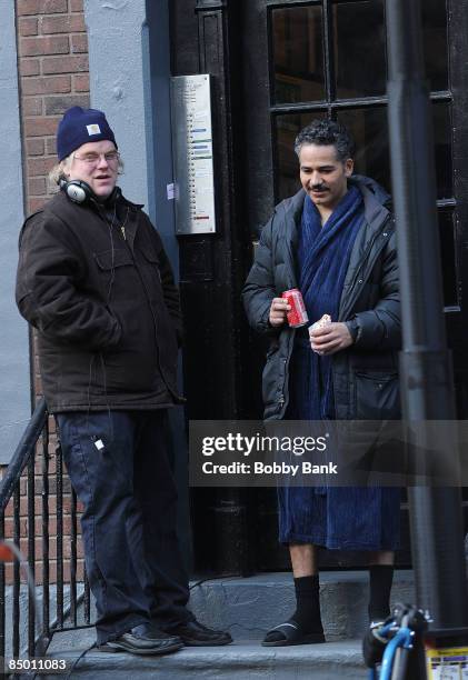 Director/Actor Philip Seymour Hoffman and John Ortiz on location for "Jack Goes Boating" on the streets of Manhattan on February 23, 2009 in New York...