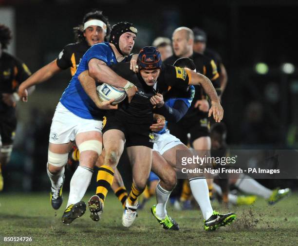 Wasps' Chris Bell is tackled by Leinster's Sean O'Brien and Dave Kearney during the Amlin Challenge Cup, Quarter Final match at Adams Park, High...