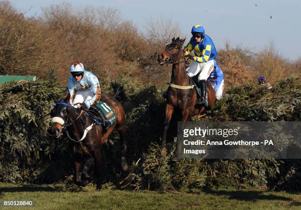 Auroras Encore ridden by Ryan Mania clears the Open Ditch before going on to win the John Smith's National Steeple Chase during Grand National Day at...