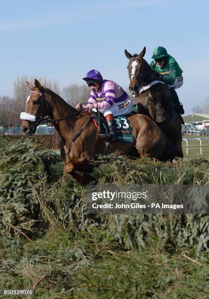 Mumbles Head and Jamie Moore block Barry Geraghty and Roberto Goldback at the final fence in the john Smith's Grand National during Grand National...