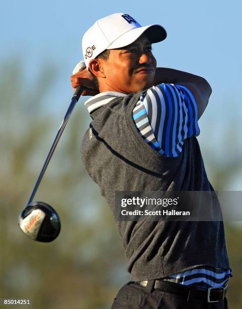 Tiger Woods hits a tee shot during a practice round prior to the start of the Accenture Match Play Championship at the Ritz-Carlton Golf Club at Dove...