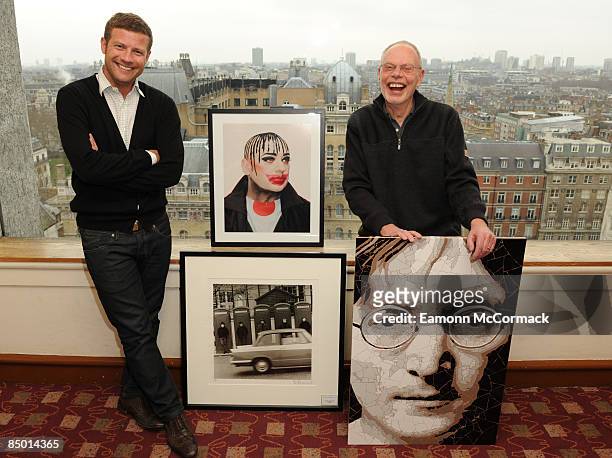 Dermot O'Leary and Bob Harris pose with selection of auction items ahead of the Cancer Research UK event 'Sound & Vision' at The Heights Restaurant...
