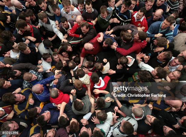 Spot the ball.. Rival teams Up'ards and Down'ards battle for the ball in the annual Shrove Tuesday 'no rules' football match on February 24 in...