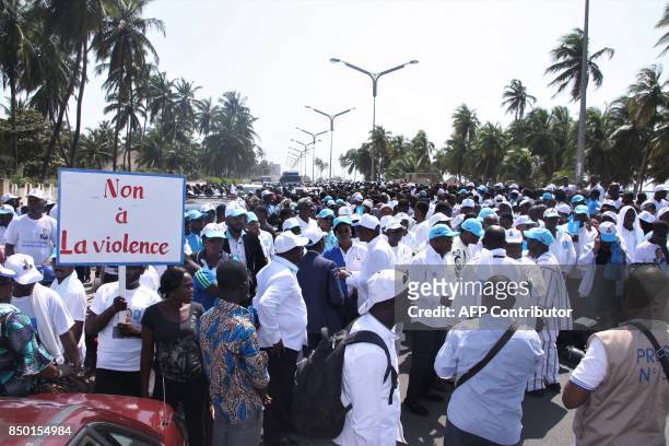 Supporters of the Togolese ruling party Union for the Republic gather ahead of a march in Lome on September 20, 2017. Thousands thronged the streets...