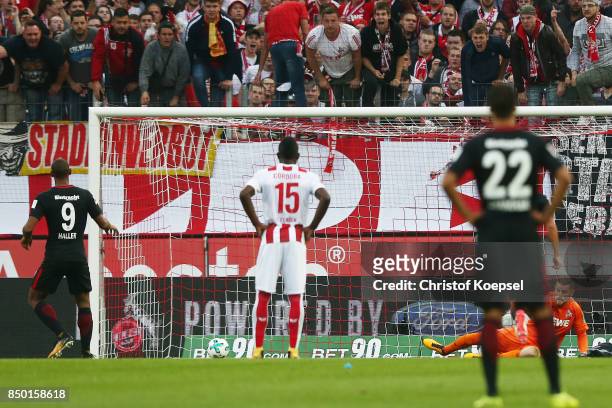 Mijat Gacinovic of Frankfurt scores his teams first goal form the penalty spot past goalkeeper Timo Horn of Koeln to make it 1:0 during the...