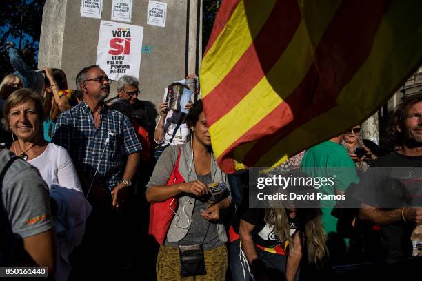 People demonstrate outside the Catalan Vice-President and Economy office as police officers holds a searching operation inside on September 20, 2017...