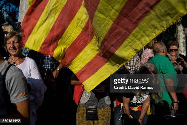 People demonstrate outside the Catalan Vice-President and Economy office as police officers holds a searching operation inside on September 20, 2017...