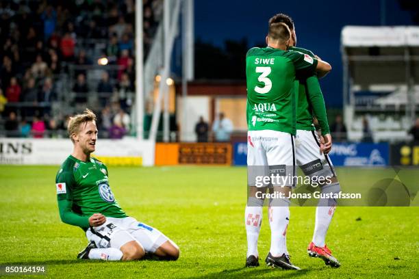 Tom Siwe and Jesper Svensson celebrate together with Dzenis Kozica after Dzenis Kozica scores 2-0 after scoringof Jonkopings Sodra celebrates after...