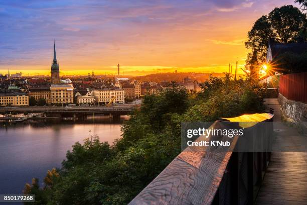 sunset over stockholm city, sweden from viewpoint on the hill - stockholm park stock pictures, royalty-free photos & images