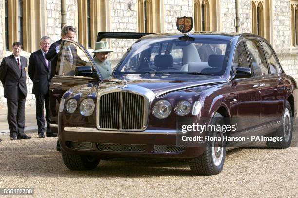 Queen Elizabeth II beside the Bentley state limousine. The Bentley is a Golden Jubilee gift to The Queen by a British based consortium of automotive...