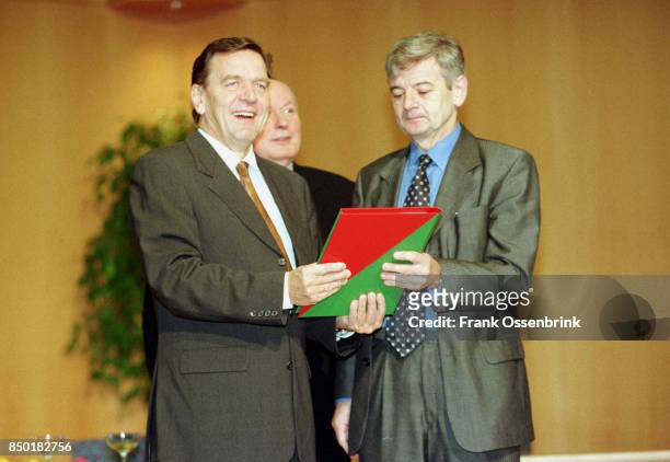 Chancellor Gerhard Schröder, Finance Minister Oskar Lafontaine and Foreign Affairs Minister Joschka Fischer.