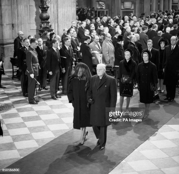 Lady Churchill takes the arm of her son, Randolph, at the head of the family mourners as they follow the coffin from St Paul's Cathedral after the...