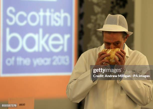 Judge David Dalgitty smells a loaf of bread during judging for the Scottish Baker of the Year 2013.