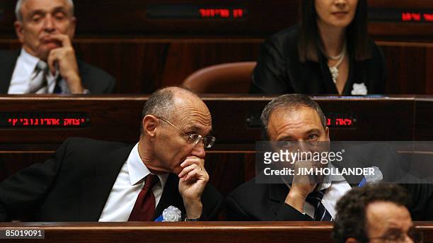 Israeli far-right Yisrael Beitenu party leader Avigdor Lieberman sits next to knesset member Uzi Landau during the swearing-in ceremony of Israel's...