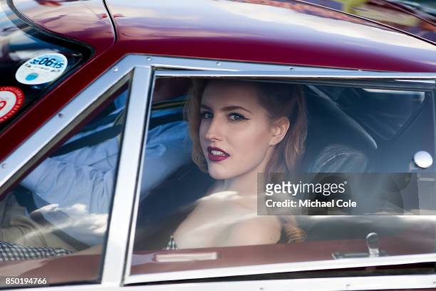 9th: Lady passenger in Ford GT40 safety car at Goodwood on September 9th 2017 in Chichester, England.