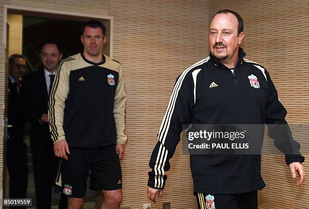 Liverpool's Spanish manager Rafael Benítez and English defender Jamie Carragher arrive for a press conference in Madrid, on February 24, 2009 on the...