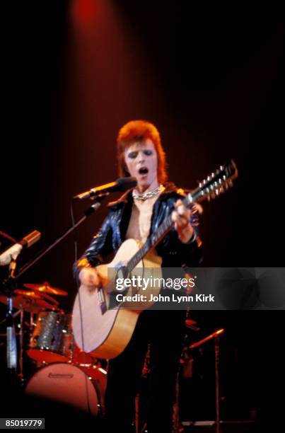 Photo of David BOWIE; performing live onstage on first date of Ziggy Stardust US Tour at the Music Hall, Cleveland, playing 12 string acoustic guitar