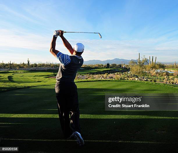 Tiger Woods of the USA plays his tee shot during practice prior to the start of the Accenture Match Play Championships at Ritz - Carlton Golf Club at...