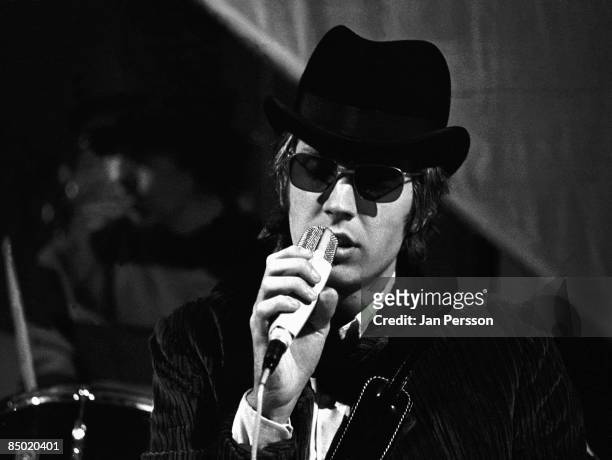Photo of Scott WALKER and WALKER BROTHERS; Scott Walker performing on TV show, wearing hat and sunglasses