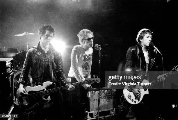Photo of Steve JONES and Johnny ROTTEN and Sid VICIOUS and SEX PISTOLS; L-R: Sid Vicious, Johnny Rotten , Steve Jones, performing on set of 'Pretty...