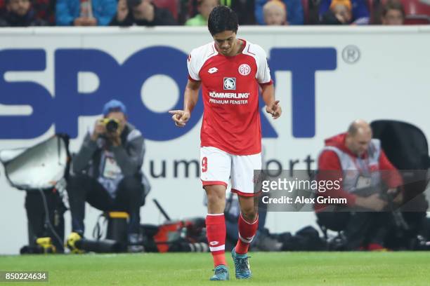 Yoshinori Muto of Mainz celebrates his team's second goal during the Bundesliga match between 1. FSV Mainz 05 and TSG 1899 Hoffenheim at Opel Arena...