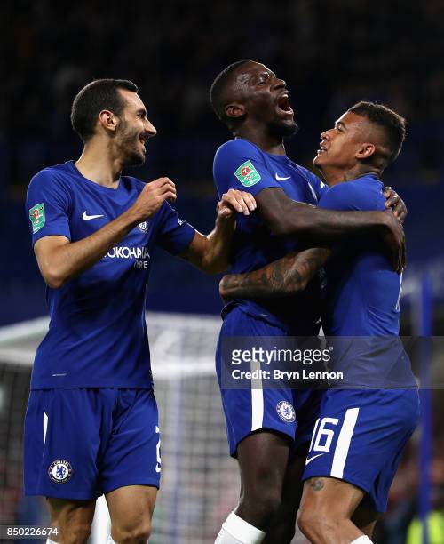 Kenedy of Chelsea celebrates scoring his sides first goal with Davide Zappacosta of Chelsea and Antonio Rudiger of Chelsea during the Carabao Cup...