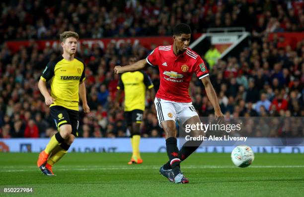 Marcus Rashford of Manchester United scores his sides first goal during the Carabao Cup Third Round match between Manchester United and Burton Albion...