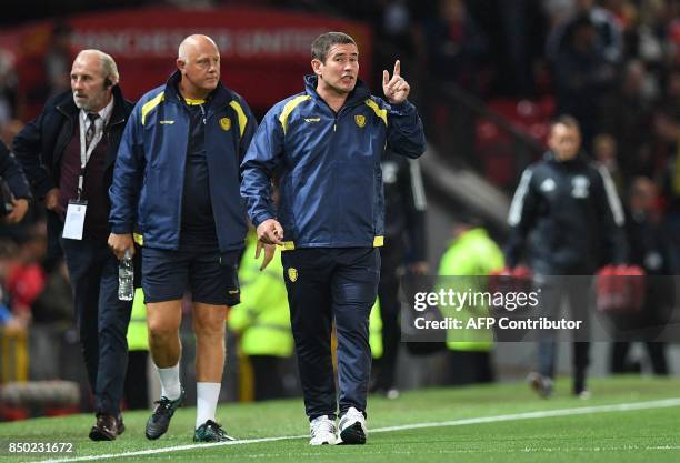 Burton Albion's English manager Nigel Clough arrives on the pitch ahead of the English League Cup third round football match between Manchester...