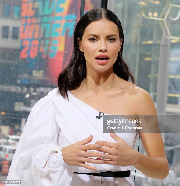 Model Adriana Lima is interviewed by A. J. Calloway during her visit to 'Extra' at their New York Studios at H&M Times Square on September 20, 2017...