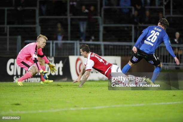 Isak Pettersson, goalkeeper of Halmstad BK and Alexander Berntsson of Halmstad BK competes for the ball with Erton Fejzullahu of Kalmar FF at Orjans...